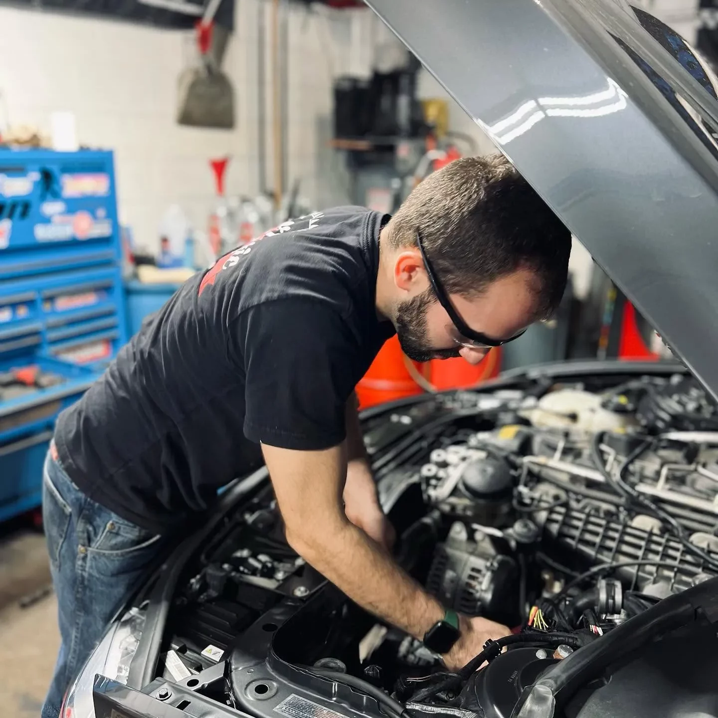 jack working on engine-squeezed